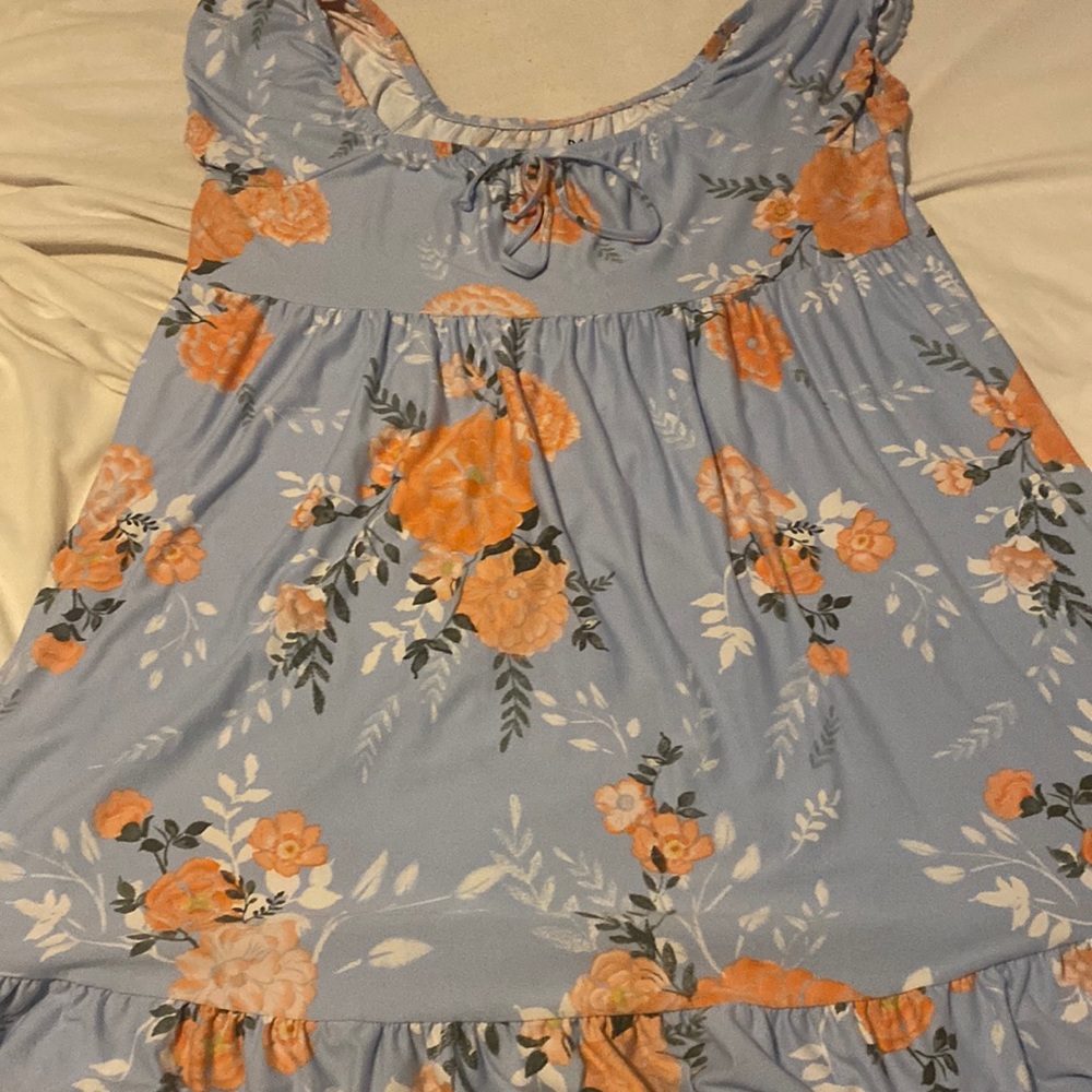 It is a light blue with flowers